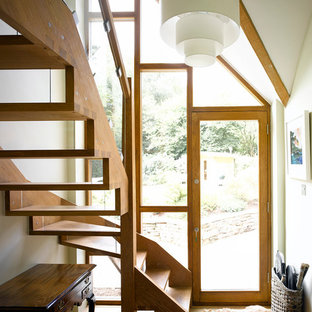 Contemporary wood l-shaped wood railing staircase in Surrey with open risers.