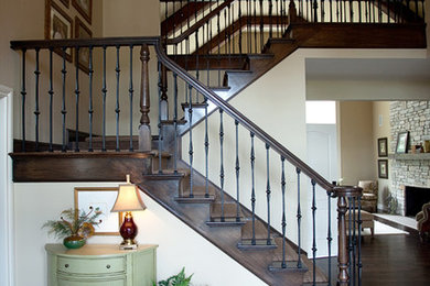 Staircase - huge traditional carpeted staircase idea in Detroit with wooden risers