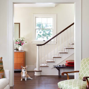 Elegant wooden wood railing staircase photo in Austin