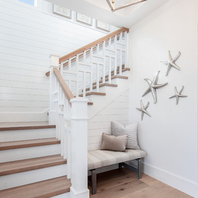 Staircase - coastal wooden l-shaped wood railing staircase idea in Other with painted risers