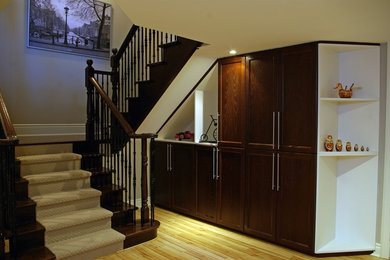 Staircase - mid-sized transitional wooden u-shaped staircase idea in Toronto with wooden risers