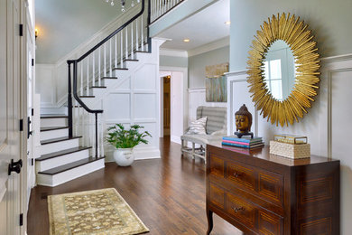 Staircase - huge transitional wooden l-shaped staircase idea in New York with wooden risers
