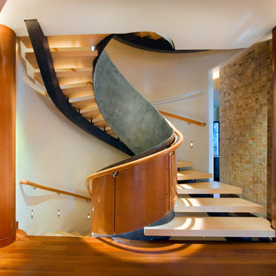 Inspiration for a contemporary curved open staircase remodel in Chicago