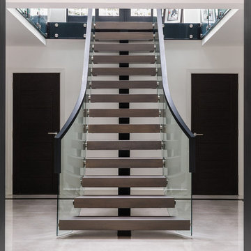 Roman Road - Curved Floating Staircase with Glass Balustrades