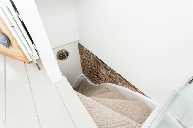 Contemporary Staircase by Westcott Construction Ltd
