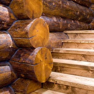 Ispirazione per un'ampia scala a "L" american style con pedata in legno e alzata in legno