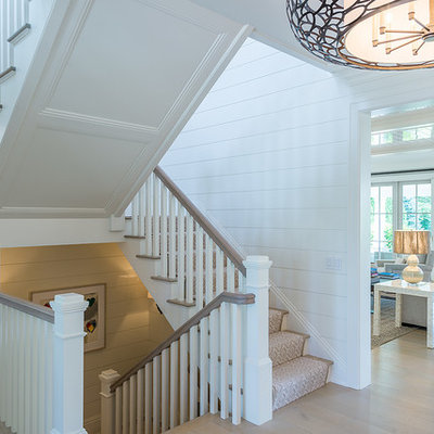 Staircase - large country wooden u-shaped wood railing staircase idea in New York with painted risers