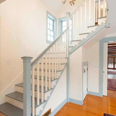 Large farmhouse painted l-shaped staircase photo in Boston with painted risers