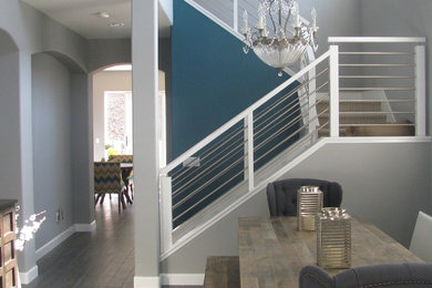 Mid-sized transitional wooden u-shaped staircase photo in San Diego with wooden risers