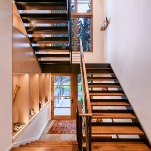 Inspiration for a large contemporary wooden u-shaped open and metal railing staircase remodel in Seattle