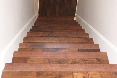 Example of a mid-sized classic wooden l-shaped staircase design in Wichita with painted risers