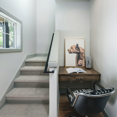 Staircase - small transitional carpeted u-shaped metal railing staircase idea in Other with carpeted risers