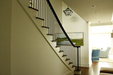 Large transitional wooden straight staircase photo in New York with painted risers