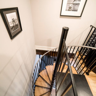 Staircase - small traditional wooden spiral metal railing staircase idea in Portland with metal risers