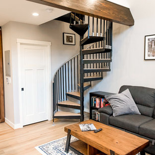 Inspiration for a small timeless wooden spiral metal railing staircase remodel in Portland with metal risers
