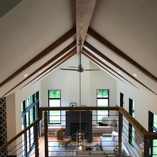 Inspiration for a mid-sized contemporary wooden straight open and cable railing staircase remodel in DC Metro