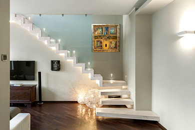 Photo of a medium sized contemporary staircase in Milan.