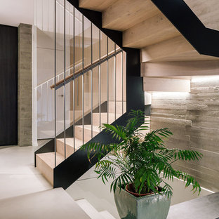 Ejemplo de escalera en U, contemporánea, de tamaño medio, con escalones de madera, contrahuellas de madera y barandilla de madera