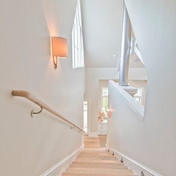 Simple staircase with a view of the great room