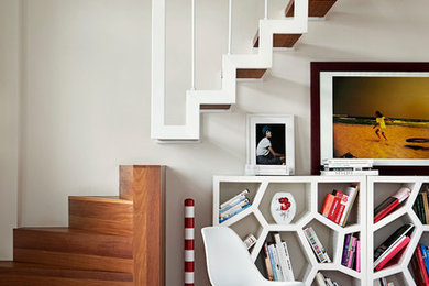 Large minimalist wooden l-shaped open staircase photo in Other