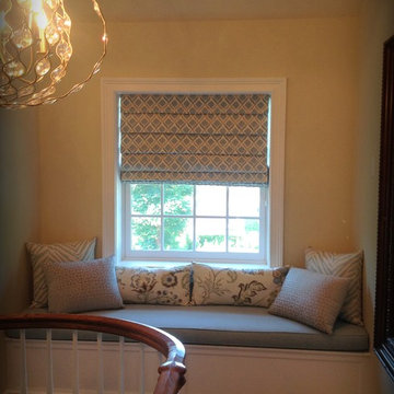 Soft fold Roman shade with window seat cushion and decorative pillows