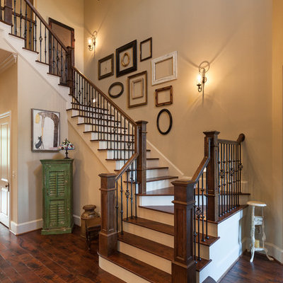 Example of a classic wooden u-shaped staircase design in Houston with painted risers