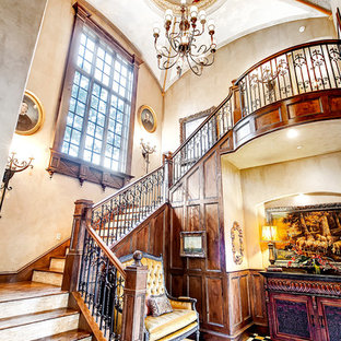 Example of a large classic wooden curved staircase design in Dallas with wooden risers