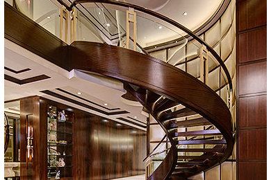 Staircase - large contemporary wooden curved open staircase idea in Birmingham