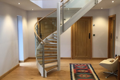 Contemporary wood curved staircase in Sussex.