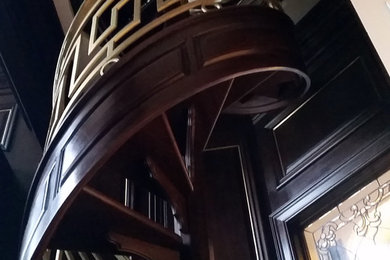 Mid-sized elegant wooden spiral open staircase photo in Chicago