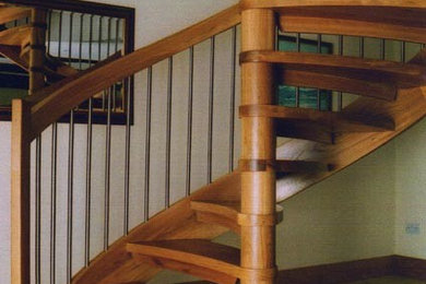 Design ideas for a contemporary wood curved staircase in Other with wood risers.