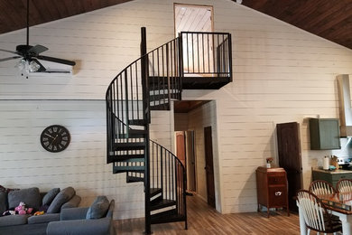 Example of a mid-sized cottage metal spiral open and metal railing staircase design in Wilmington
