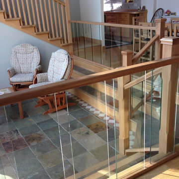 Split level living area with glass spindles