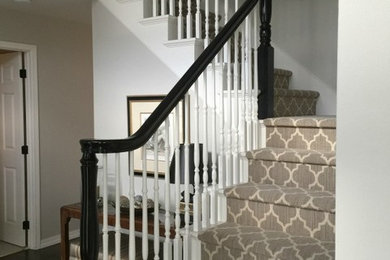 Example of a mid-sized classic carpeted l-shaped wood railing staircase design in Seattle with carpeted risers