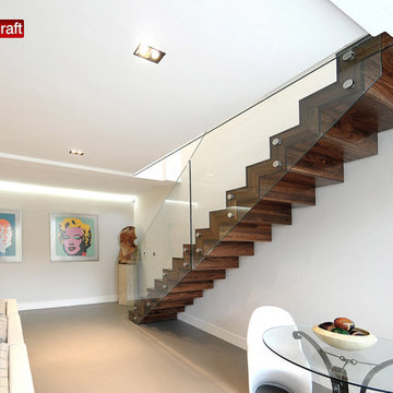 St Quintins - Straight Staircase with glass balustrade and walnut treads