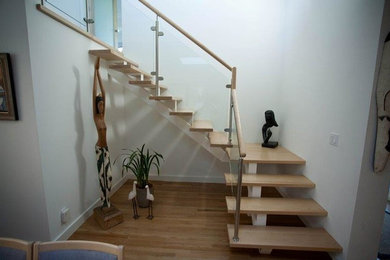 Example of a trendy wooden l-shaped wood railing staircase design in Orange County