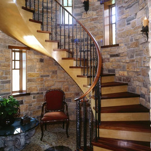 Example of a mid-sized classic wooden curved wood railing staircase design in Minneapolis with wooden risers