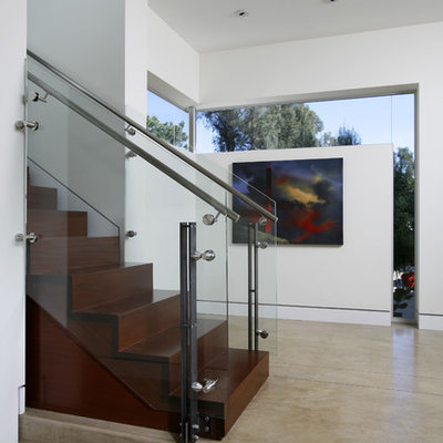 Example of a minimalist wooden staircase design in Los Angeles with wooden risers