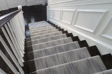 Example of a mid-sized transitional wooden straight staircase design in Boston