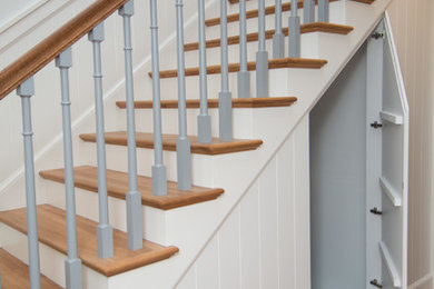 Staircase - traditional wooden straight staircase idea in Milwaukee