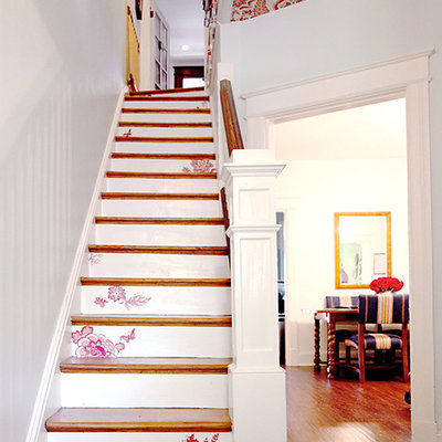Inspiration for a shabby-chic style wooden straight staircase remodel in DC Metro with painted risers