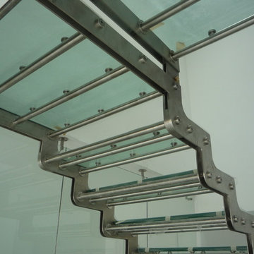 Staircase E design - Floating with glass and Stainless Steel.
