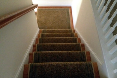 Example of a small transitional wooden l-shaped staircase design in Richmond with wooden risers