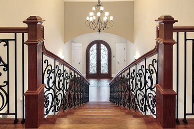 Inspiration for a mid-sized victorian wooden straight staircase remodel in New York with wooden risers