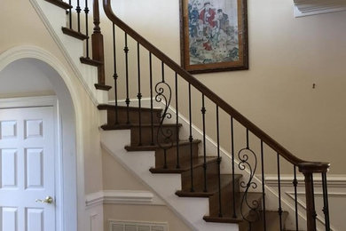 Medium sized traditional wood l-shaped mixed railing staircase in Charlotte with wood risers.