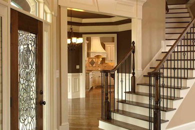 Example of a large classic wooden l-shaped staircase design in Atlanta with painted risers