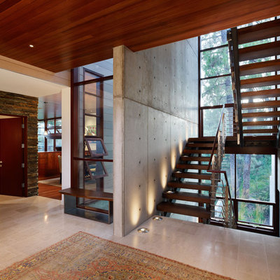 Minimalist wooden u-shaped open staircase photo in Los Angeles