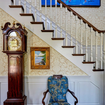Staircase Vingette with Antique Grandfather Clock and Blue Artwork