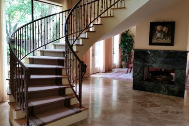 Example of an arts and crafts metal floating staircase design in Houston with metal risers