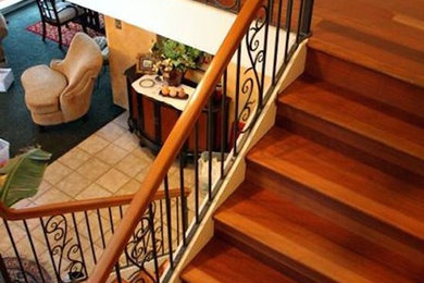 Staircase - transitional wooden l-shaped staircase idea in Sacramento with wooden risers